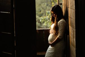 woman holding her pregnant belly