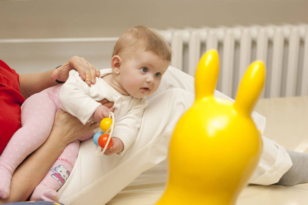 child being held by woman